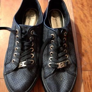 Michael Kors flat sneakers.
